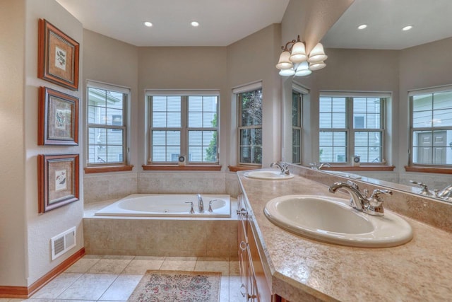 1826 Stonebridge Rd, Waukesha, WI 53188 - full bath with a garden tub, tile patterned flooring, double vanity, and recessed lighting
