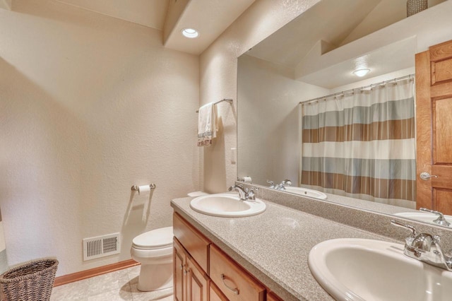 1826 Stonebridge Rd, Waukesha, WI 53188 - full bathroom featuring toilet, tile patterned floors, double vanity, and a shower with shower curtain
