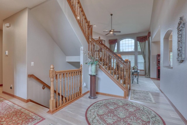 1826 Stonebridge Rd, Waukesha, WI 53188 - stairs with a ceiling fan, wood finished floors, and baseboards