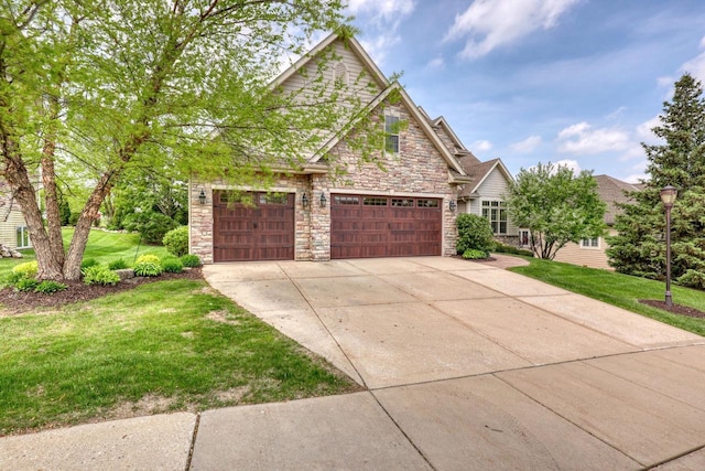 1826 Stonebridge Rd, Waukesha, WI 53188 - view of front facade with stone siding, a front yard, driveway, and a garage