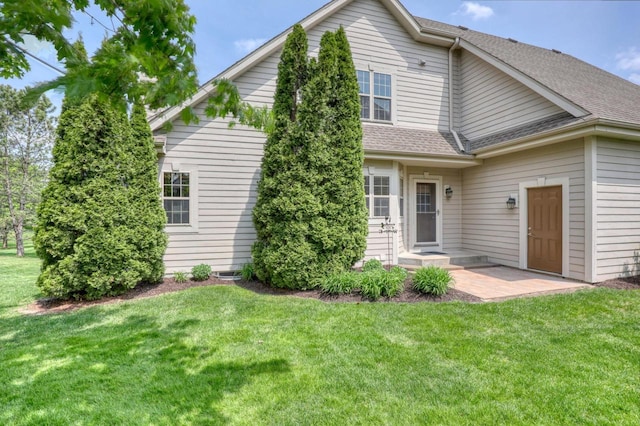1826 Stonebridge Rd, Waukesha, WI 53188 - back of house featuring a yard and a shingled roof