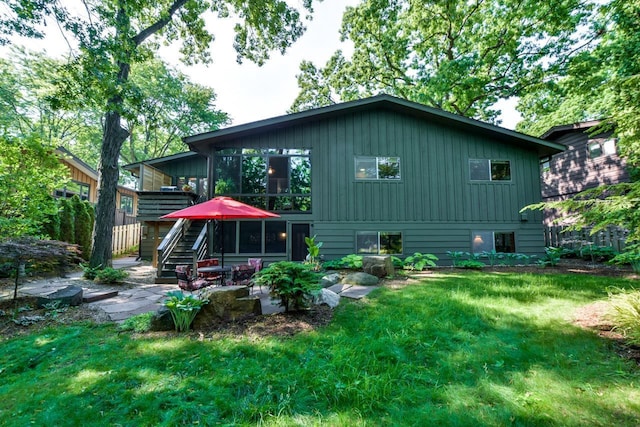 3914 Priscilla Ln, Madison, WI 53705 - back of house featuring a lawn and stairway