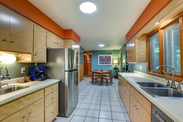 3914 Priscilla Ln, Madison, WI 53705 - kitchen with a sink, appliances with stainless steel finishes, light brown cabinets, and light tile patterned flooring