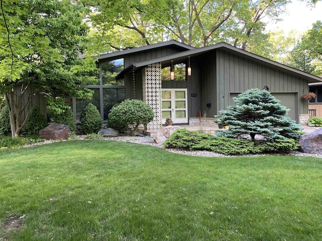 3914 Priscilla Ln, Madison, WI 53705 - view of front of home with an attached garage and board and batten siding