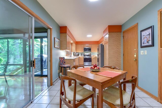 3914 Priscilla Ln, Madison, WI 53705 - dining room with light tile patterned flooring and baseboards