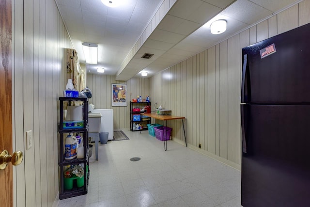 3914 Priscilla Ln, Madison, WI 53705 - finished below grade area with freestanding refrigerator, tile patterned floors, wood walls, and washer / clothes dryer