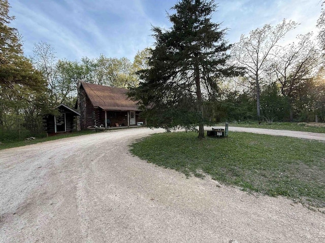 N8718 Starr Rd, Portage, WI 53901 - view of front of property featuring curved driveway and log siding