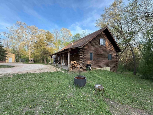 N8718 Starr Rd, Portage, WI 53901 - view of property exterior with log siding and a yard