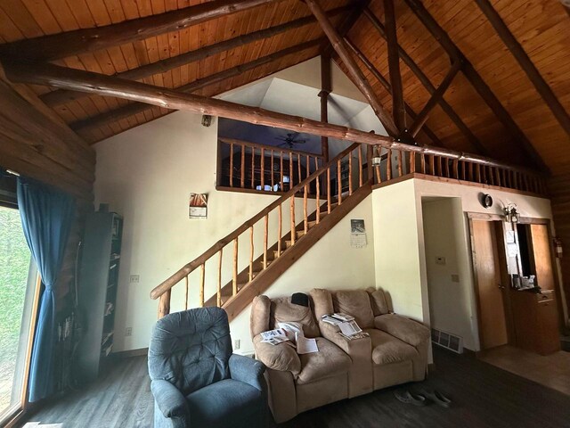 N8718 Starr Rd, Portage, WI 53901 - living area with wood ceiling with exposed beams, wood finished floors, stairway, ceiling fan, and high vaulted ceiling
