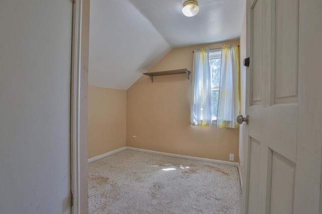 1407 N 7th St, Wausau, WI 54403 - additional living space with vaulted ceiling, baseboards, and carpet floors