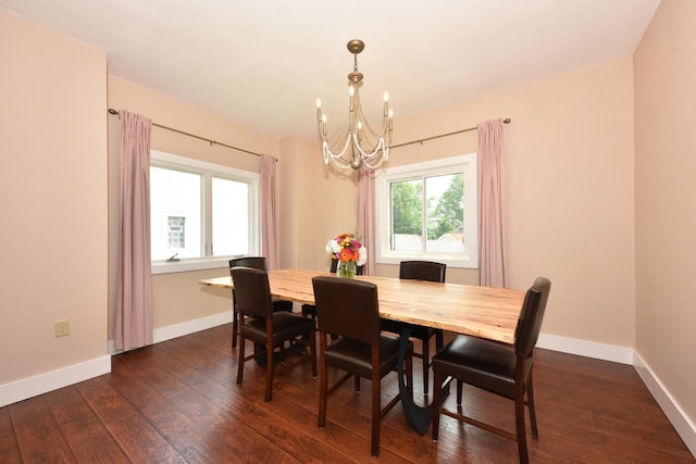 3727 E Layton Ave, Cudahy, WI 53110 - dining space with a chandelier, dark wood-style flooring, and baseboards