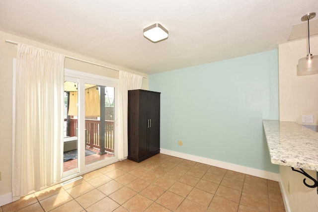 3727 E Layton Ave, Cudahy, WI 53110 - empty room featuring baseboards and light tile patterned flooring