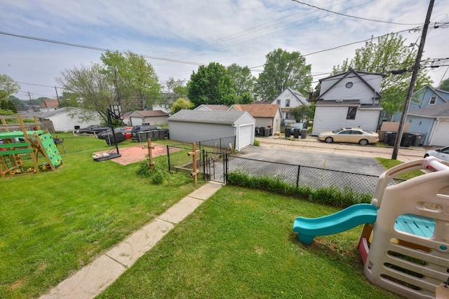 3727 E Layton Ave, Cudahy, WI 53110 - view of yard with a playground, a gate, a detached garage, and a residential view