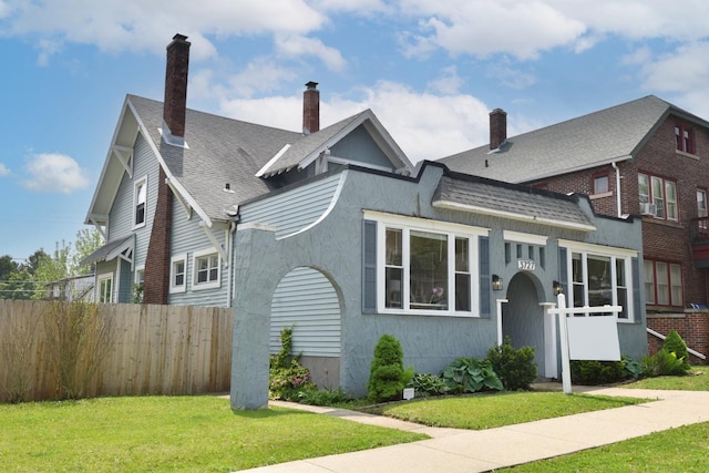 3727 E Layton Ave, Cudahy, WI 53110 - view of front of house with a chimney and a shingled roof