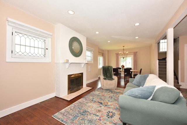 3727 E Layton Ave, Cudahy, WI 53110 - living room featuring baseboards, a chandelier, dark wood-style floors, stairs, and recessed lighting