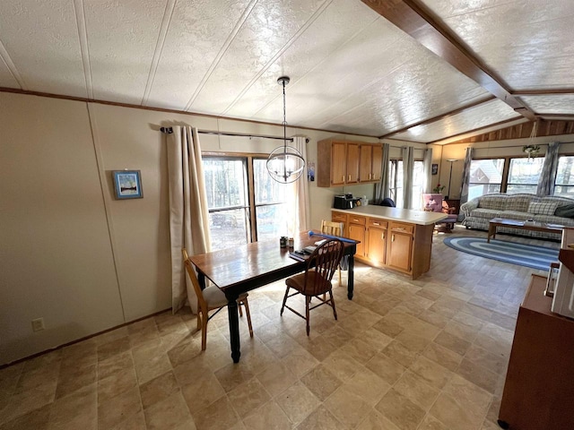 3185 S Faust Lake Rd, Rhinelander, WI 54501 - dining space with lofted ceiling and a chandelier
