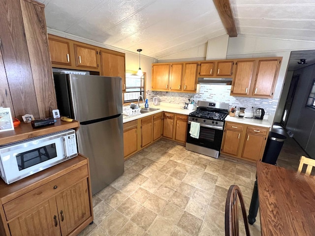 3185 S Faust Lake Rd, Rhinelander, WI 54501 - kitchen featuring appliances with stainless steel finishes, light countertops, brown cabinets, tasteful backsplash, and a sink