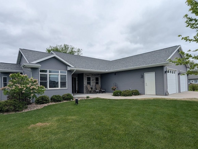 5235 Killdeer Ln, Oshkosh, WI 54901 - ranch-style house featuring roof with shingles, an attached garage, and a front yard