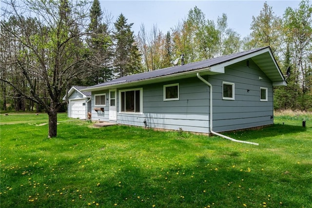 4620W Sweitzer Rd, Winter, WI 54896 - single story home with a front yard, a garage, and metal roof