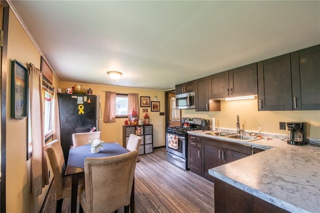 4620W Sweitzer Rd, Winter, WI 54896 - kitchen featuring stainless steel appliances, a sink, dark wood-type flooring, and dark brown cabinetry