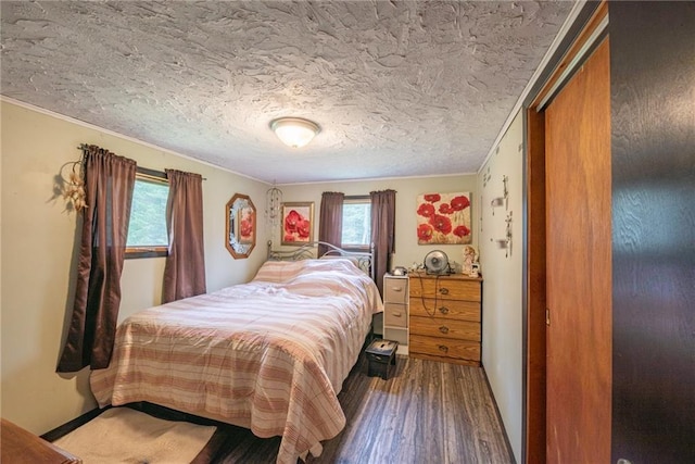 4620W Sweitzer Rd, Winter, WI 54896 - bedroom with wood finished floors, ornamental molding, and a textured ceiling