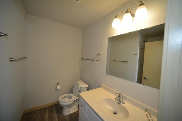 387 Bella Way, Sun Prairie, WI 53590 - bathroom with toilet, wood finished floors, vanity, and baseboards