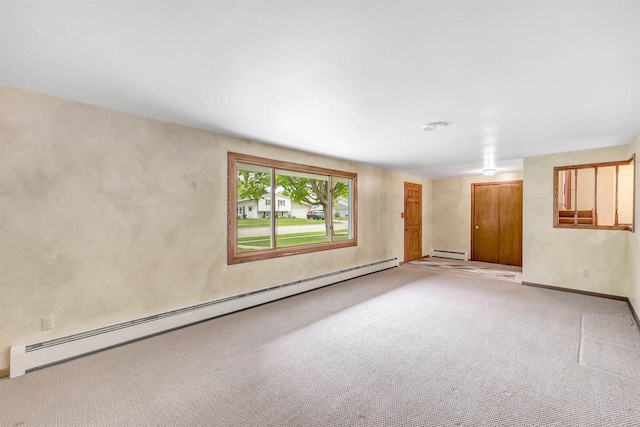 2044 E Vista Cir, De Pere, WI 54115 - spare room with a baseboard heating unit, baseboard heating, and light colored carpet