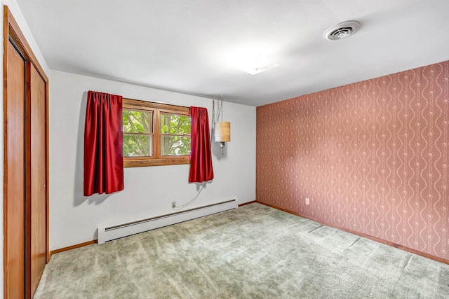 2044 E Vista Cir, De Pere, WI 54115 - unfurnished room featuring a baseboard radiator, wallpapered walls, carpet flooring, and baseboards