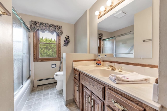 2044 E Vista Cir, De Pere, WI 54115 - bathroom with baseboard heating, toilet, vanity, and enclosed tub / shower combo