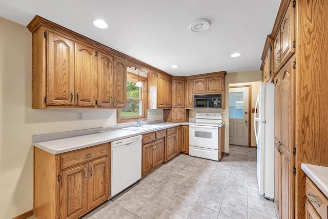 2044 E Vista Cir, De Pere, WI 54115 - kitchen with white appliances, a sink, brown cabinetry, and recessed lighting