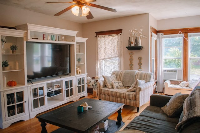 202 Wisconsin St, Mauston, WI 53948 - living area featuring ceiling fan, cooling unit, and wood finished floors