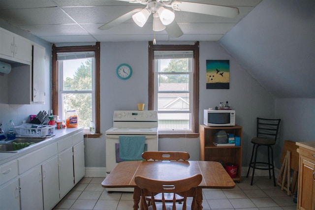 202 Wisconsin St, Mauston, WI 53948 - kitchen featuring white appliances, light tile patterned flooring, a sink, light countertops, and ceiling fan