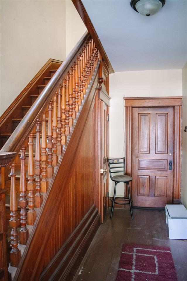 202 Wisconsin St, Mauston, WI 53948 - staircase featuring hardwood / wood-style floors