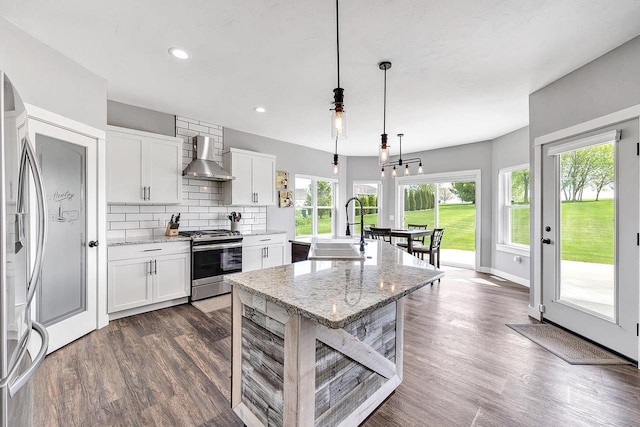 441 Longwood Ln, Wrightstown, WI 54180 - kitchen with appliances with stainless steel finishes, a sink, wall chimney exhaust hood, dark wood-style flooring, and recessed lighting