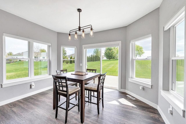 441 Longwood Ln, Wrightstown, WI 54180 - dining room with plenty of natural light, baseboards, dark wood-style floors, and a chandelier