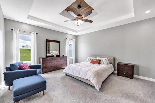 441 Longwood Ln, Wrightstown, WI 54180 - bedroom with a raised ceiling, light carpet, recessed lighting, baseboards, and a ceiling fan