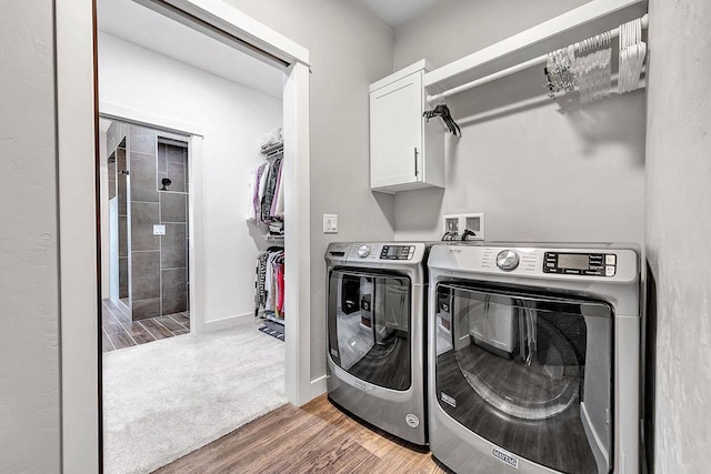 441 Longwood Ln, Wrightstown, WI 54180 - laundry area featuring cabinet space, separate washer and dryer, wood finished floors, and baseboards
