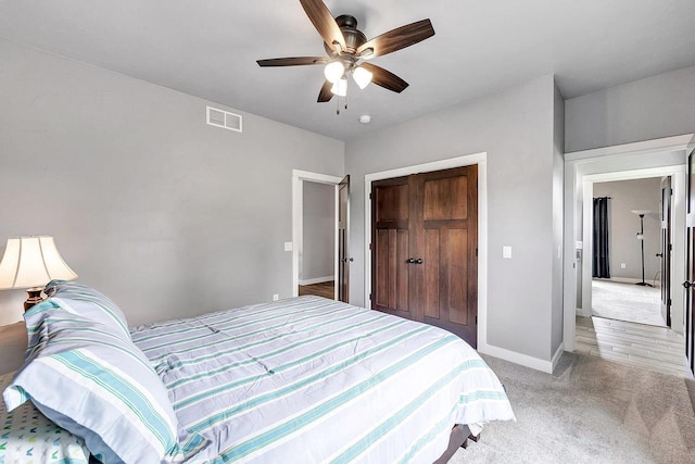 441 Longwood Ln, Wrightstown, WI 54180 - bedroom featuring baseboards, light carpet, a closet, and a ceiling fan