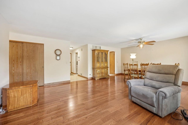 5748 Cambridge Ln Unit 3, Mount Pleasant, WI 53406 - living area featuring a ceiling fan, light wood finished floors, and baseboards
