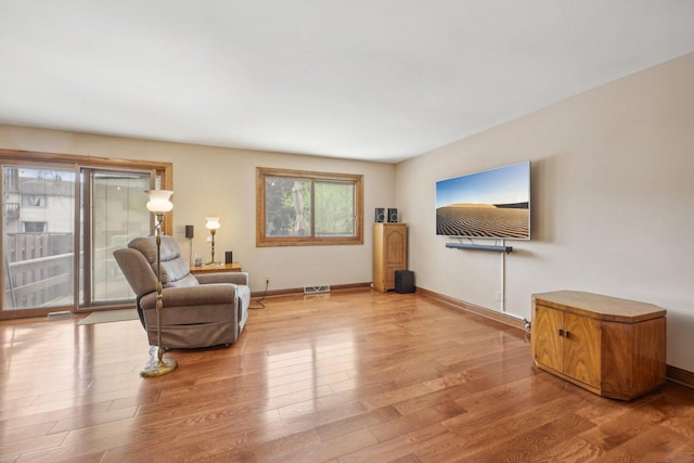 5748 Cambridge Ln Unit 3, Mount Pleasant, WI 53406 - living area featuring wood finished floors and baseboards
