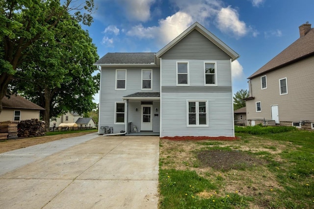 217 E Division St, Dodgeville, WI 53533 - traditional-style home with concrete driveway