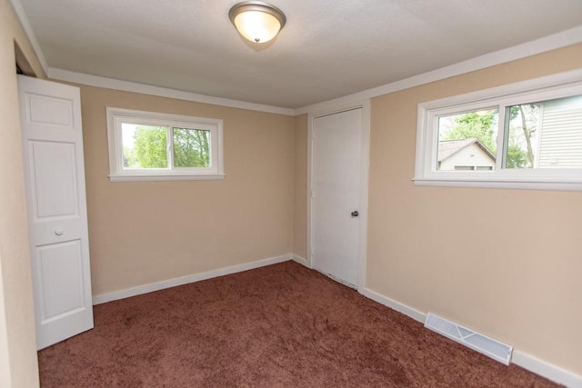 217 E Division St, Dodgeville, WI 53533 - unfurnished bedroom featuring carpet flooring, baseboards, and a closet