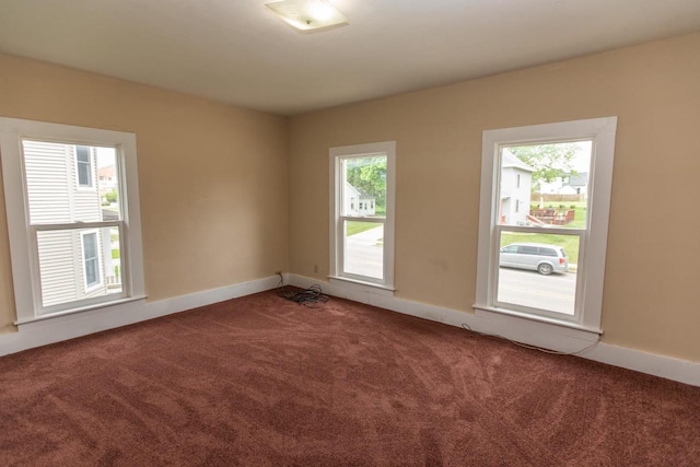 217 E Division St, Dodgeville, WI 53533 - unfurnished room featuring carpet flooring and baseboards