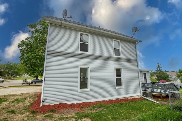 217 E Division St, Dodgeville, WI 53533 - rear view of house featuring central AC unit and a wooden deck