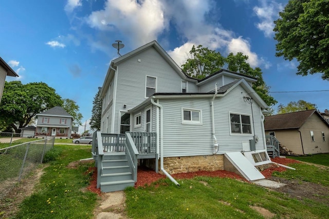 217 E Division St, Dodgeville, WI 53533 - rear view of property with a deck