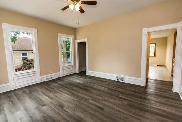 217 E Division St, Dodgeville, WI 53533 - spare room with plenty of natural light, dark wood-style flooring, and a ceiling fan