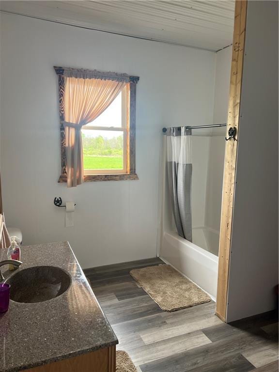 14518 State Highway 73, Lublin, WI 54447 - bathroom with wood finished floors, shower / bath combination with curtain, and vanity
