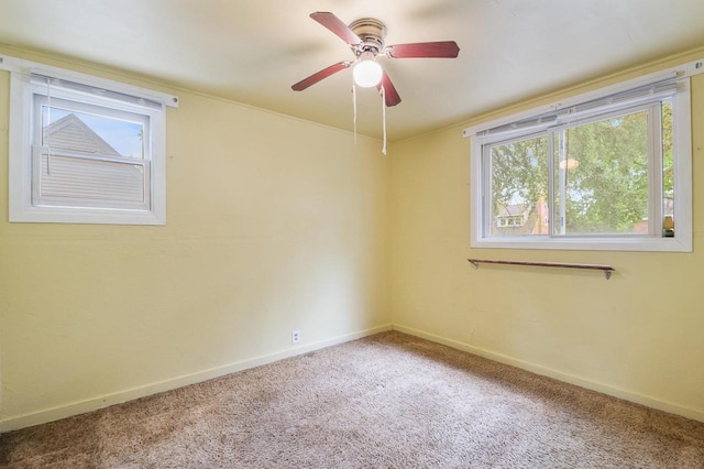 745 Carver Ln, Menasha, WI 54952 - carpeted spare room featuring plenty of natural light, baseboards, and ceiling fan