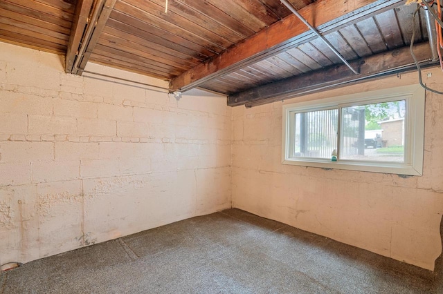 745 Carver Ln, Menasha, WI 54952 - empty room featuring wooden ceiling with exposed beams and carpet
