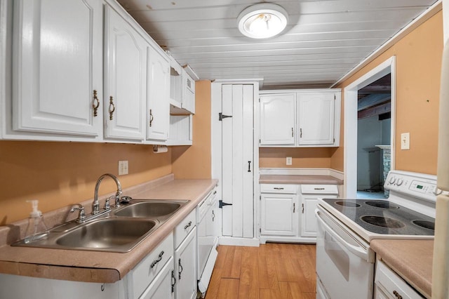 745 Carver Ln, Menasha, WI 54952 - kitchen with white appliances, a sink, white cabinetry, and light wood-style flooring
